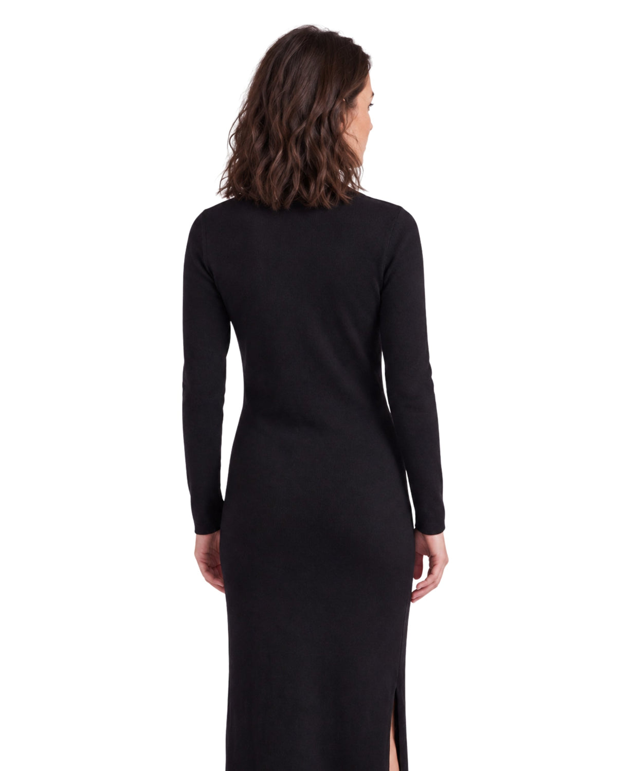 Back view of a niffty black long-sleeve knit midi dress with a side slit on a model against a white background