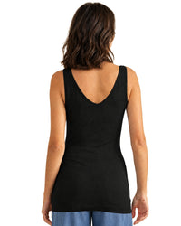 niffty black reversible seamless tank top with wide straps and a fitted silhouette worn by a woman, back view