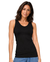 niffty black reversible seamless tank top with wide straps worn by a woman against a white background
