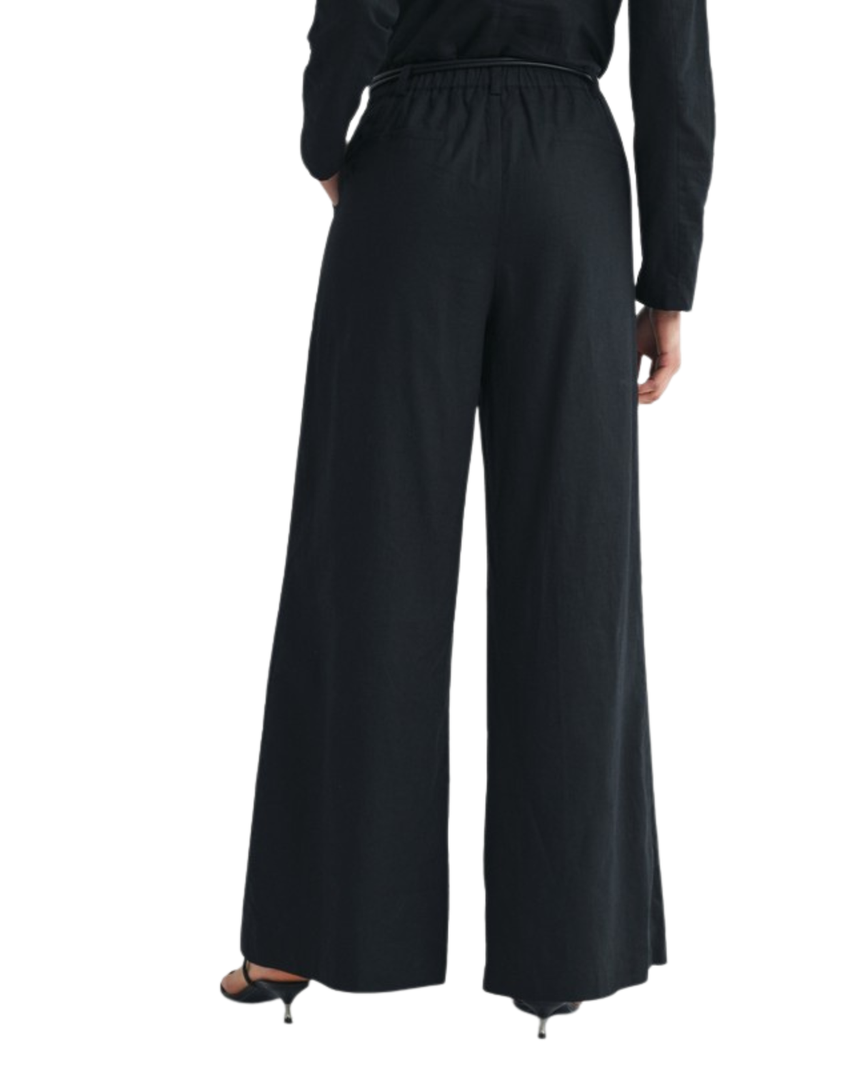 Back view of niffty black wide-leg linen-cotton trousers with a high-rise waist and tailored fit on a model