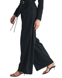 niffty black wide-leg tailored trousers in a linen-cotton blend with a gold-accented tie belt, side view