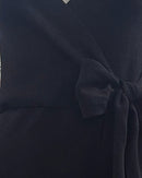 niffty black knit midi dress featuring a flattering wrap silhouette with a self-tie waist belt and V-neckline
