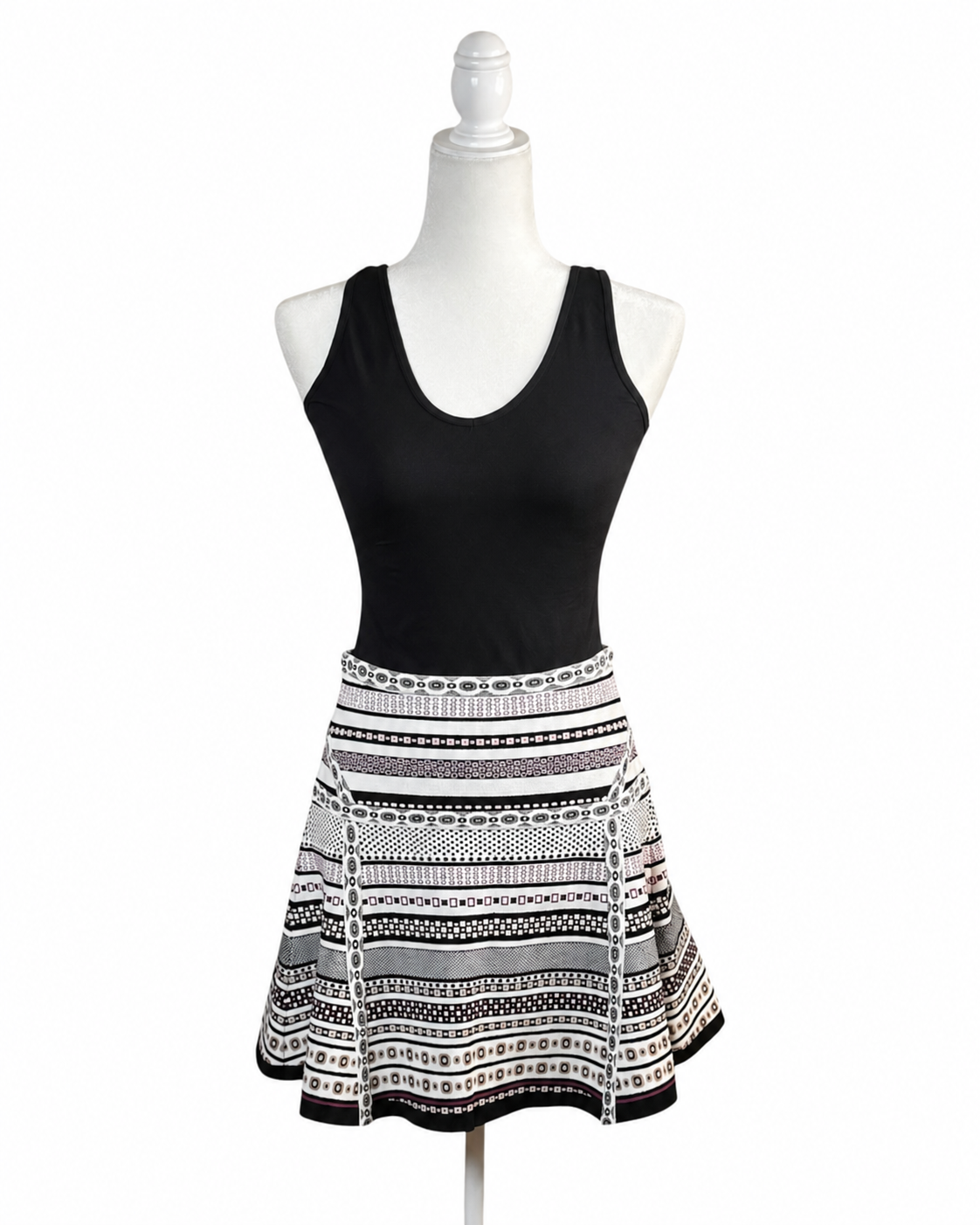niffty Diane von Furstenberg A-line skirt featuring a black, white, and purple geometric stripe print on a mannequin.