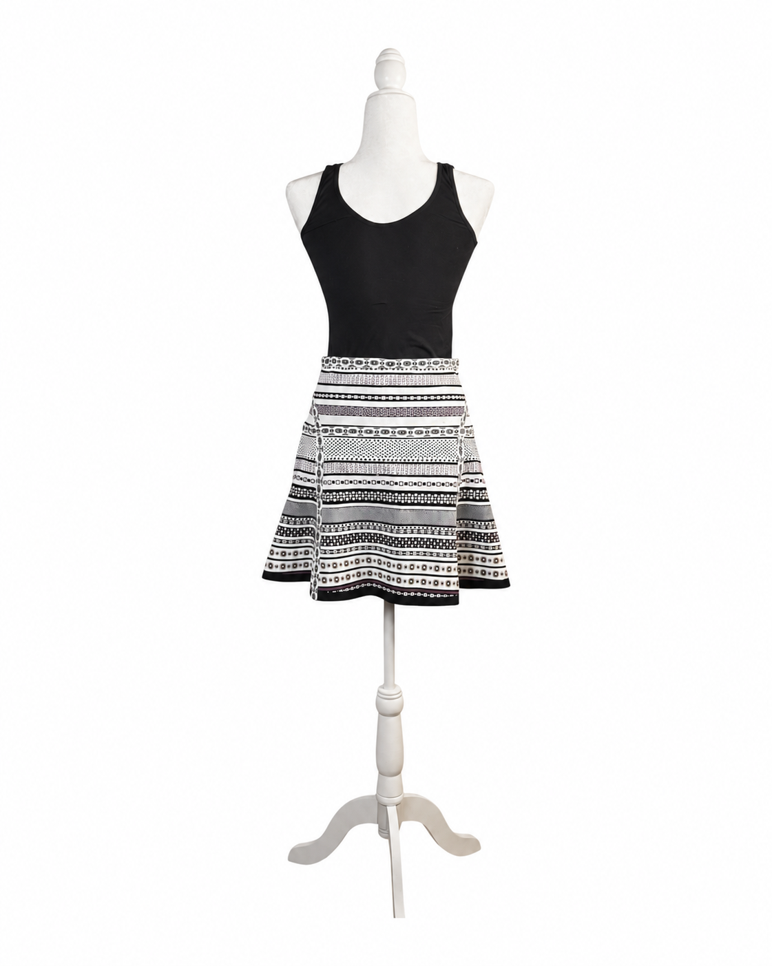 niffty Diane von Furstenberg A-line skirt featuring a black, white, and purple geometric stripe print on a mannequin.