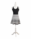 niffty Diane von Furstenberg A-line skirt featuring a black, white, and purple geometric stripe print on a mannequin.