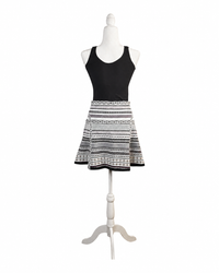 niffty Diane von Furstenberg A-line skirt featuring a black, white, and purple geometric stripe print on a mannequin.