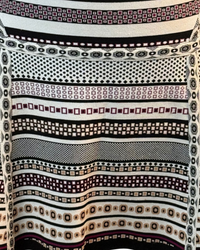 niffty Diane von Furstenberg A-line skirt featuring a black, white, and purple geometric stripe knit pattern