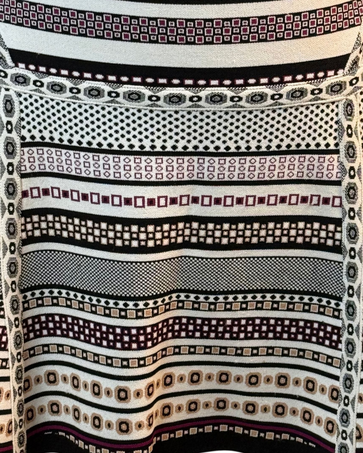 niffty Diane von Furstenberg A-line skirt featuring a black, white, and purple geometric stripe knit pattern