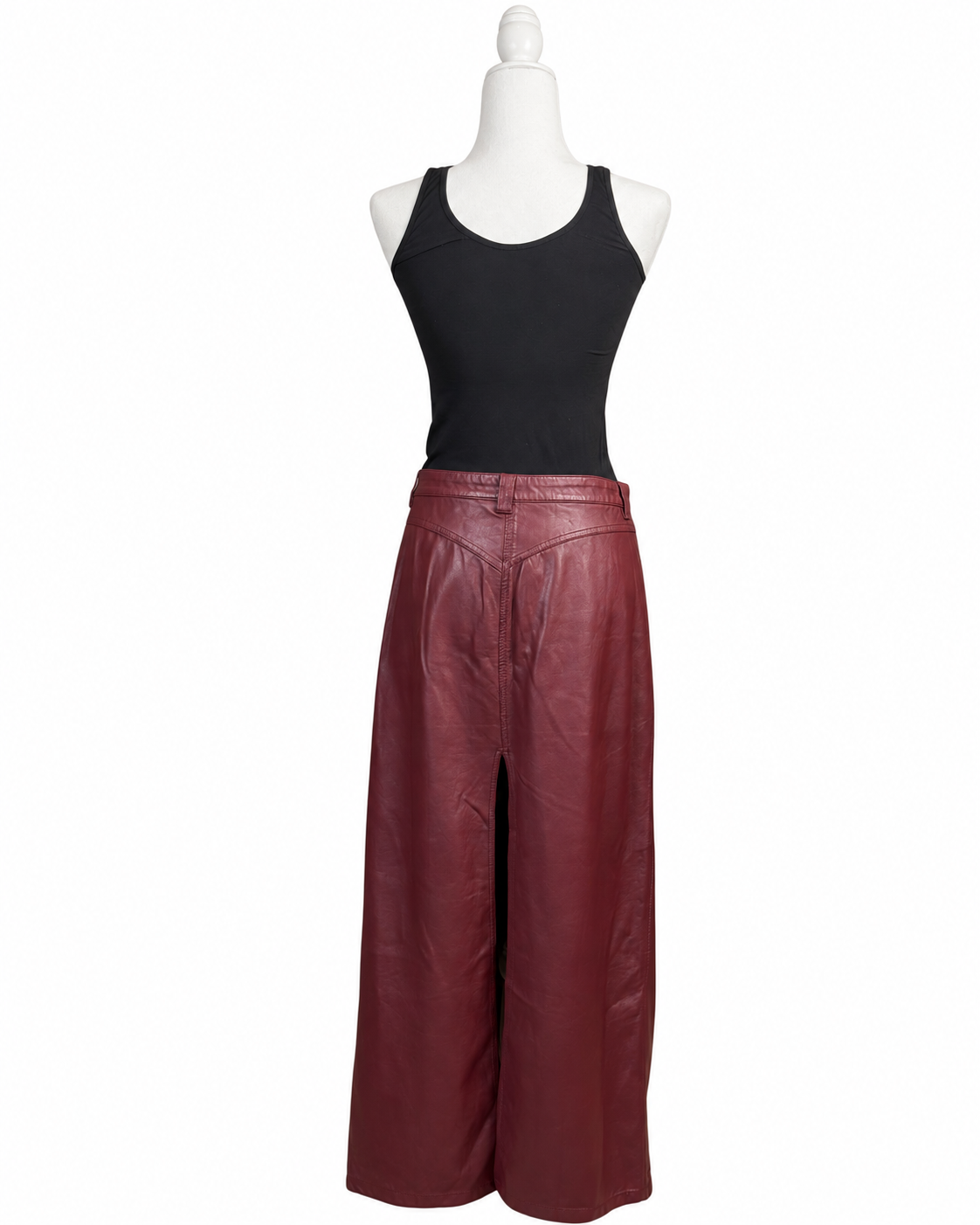 niffty Free People burgundy vegan leather maxi skirt with front slit and straight silhouette on a mannequin