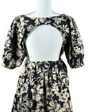 niffty Free People Dear Delilah mini dress in black and cream floral print with puff sleeves and open back detail