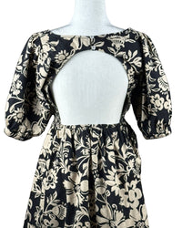 niffty Free People Dear Delilah mini dress in black and cream floral print with puff sleeves and open back detail