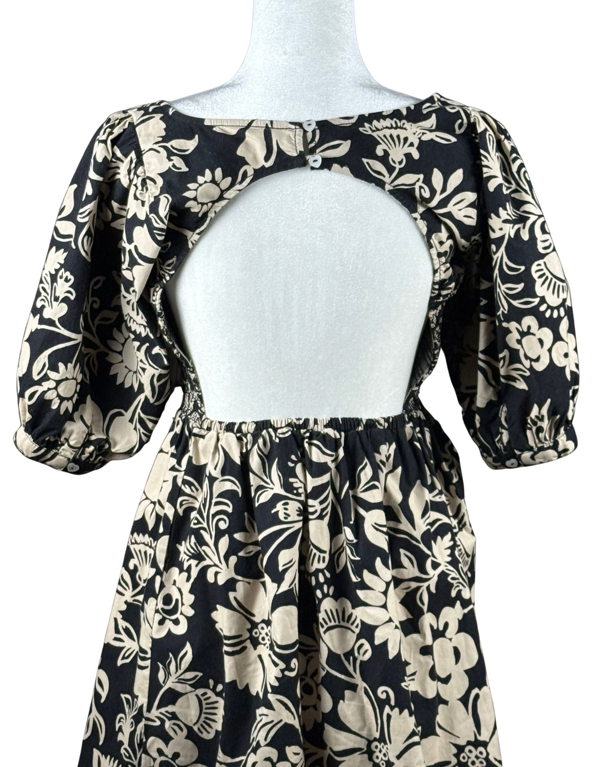 niffty Free People Dear Delilah mini dress in black and cream floral print with puff sleeves and open back detail