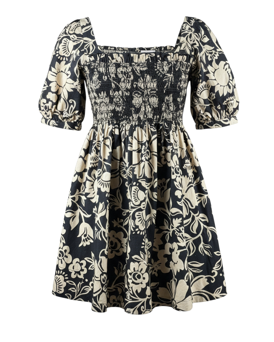 niffty Free People Dear Delilah mini dress in black and cream floral print with smocked bust and puff sleeves