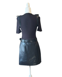 Back view of niffty Jonathan SIMKHAI Anisa black mini dress featuring a ribbed knit bodice and vegan leather skirt.