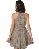 niffty leopard print chiffon mini dress with halter neckline and ruffled hem seen from the back