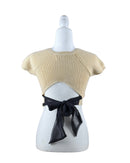 niffty Lovers and Friends nude cropped knit top with short sleeves, crew neck, and black open-back tie closure