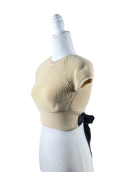 niffty Lovers and Friends nude cropped knit top with short sleeves and a contrasting black open-back tie closure