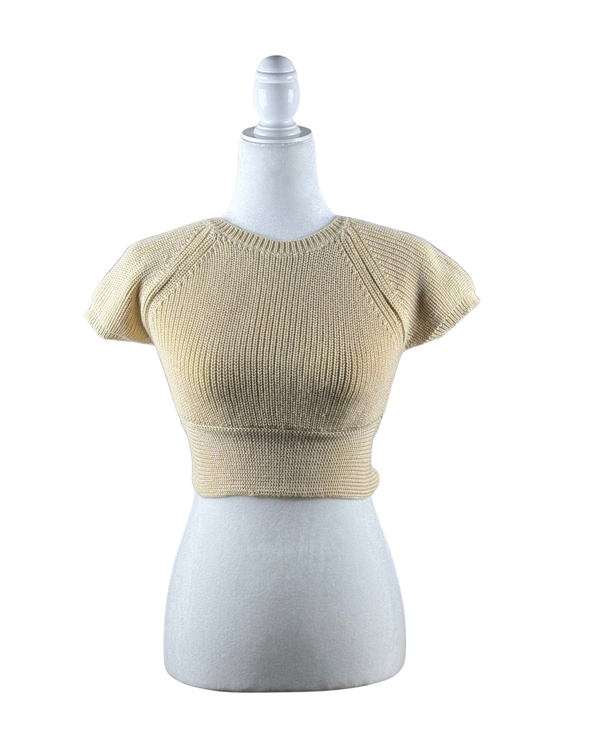niffty Lovers and Friends nude cropped knit top with crew neckline and short sleeves on a mannequin