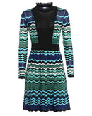 niffty M Missoni long-sleeve dress with blue, green, and black wave-pattern knit, ruffled neckline, and black panel.