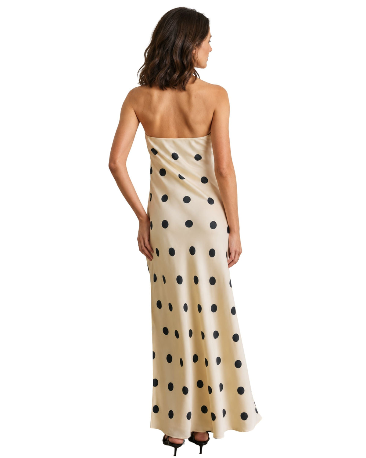 niffty strapless maxi dress in cream with black polka dots, featuring a flowing silhouette and back view