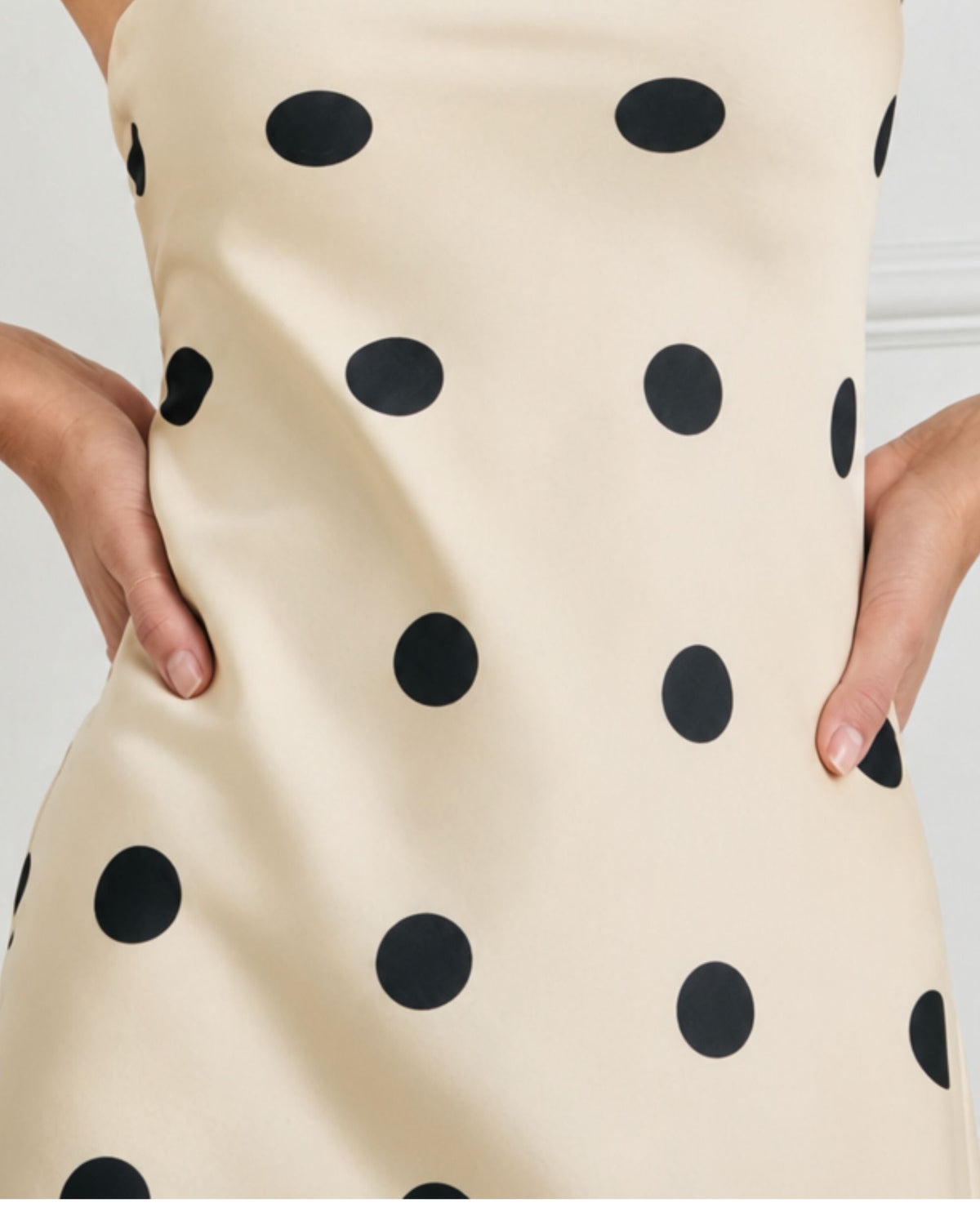 niffty strapless maxi dress in cream with black polka dots, featuring a smooth polyester fabric