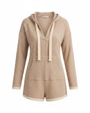 niffty taupe waffle knit hooded romper with long sleeves, contrasting drawstring, and pockets