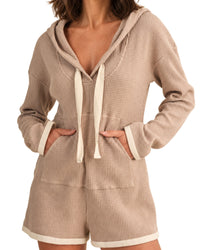 niffty taupe waffle knit hooded romper with long sleeves, contrasting drawstring, and cream trim on white background