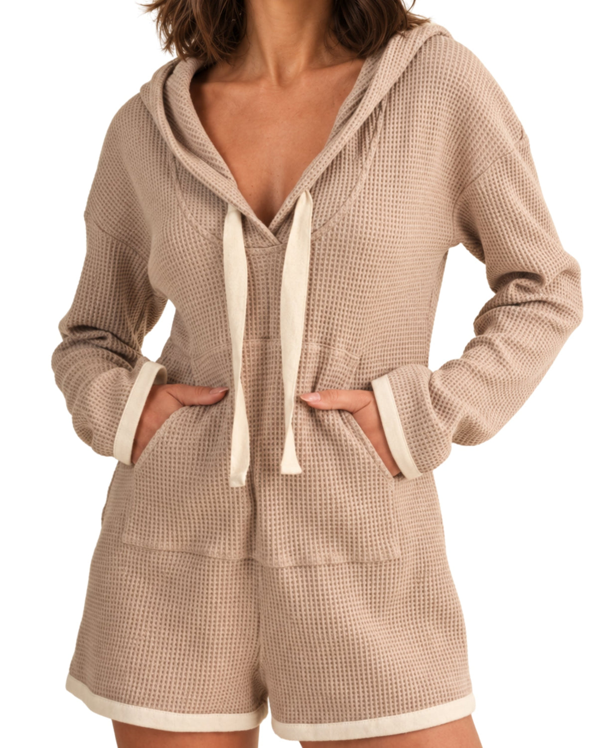 niffty taupe waffle knit hooded romper with long sleeves, contrasting drawstring, and cream trim on white background
